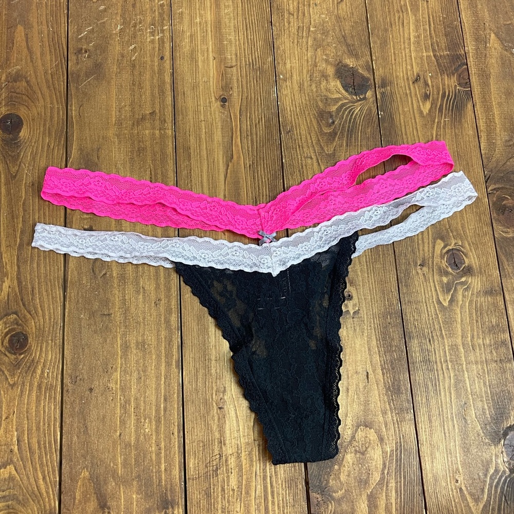 Victoria’s Secret size Medium black, white and pink lace thong panties